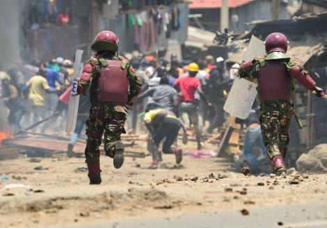 Riot police officers disperse supporters of Kenya's opposition Azimio La Umoja (Declaration of Unity) One Kenya Alliance, during nationwide protests over the cost of living and alleged fraud during the 2022 elections, in Mathare settlement of Nairobi, March 27, 2023. © 2023 REUTERS/John Muchucha